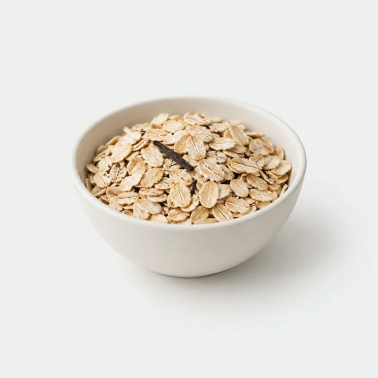 Dry vanilla oats in a plain ceramic bowl